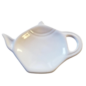 Get one of our cute retro-inspired teapot-shaped tea bag holders to help keep the drips from your teabags from going anywhere!  White, single glaze lead-free ceramic ware.  Approximately 5" w x 3.25" h