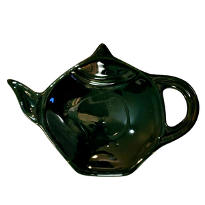 Get one of our cute retro-inspired teapot-shaped tea bag holders to help keep the drips from your teabags from going anywhere!  Green color, single glaze lead-free ceramic ware.  Approximately 5" w x 3.25" h