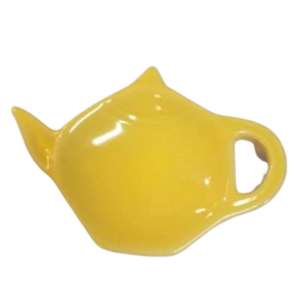 Get one of our cute retro-inspired teapot-shaped tea bag holders to help keep the drips from your teabags from going anywhere!  Lemon Yellow color, single glaze lead-free ceramic ware.  Approximately 5