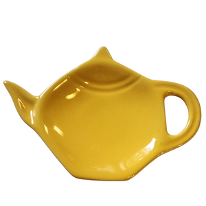 Get one of our cute retro-inspired teapot-shaped tea bag holders to help keep the drips from your teabags from going anywhere!  Yellow color, single glaze lead-free ceramic ware.  Approximately 5" w x 3.25" 