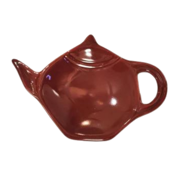 Get one of our cute retro-inspired teapot-shaped tea bag holders to help keep the drips from your teabags from going anywhere!  Burgundy, single glaze lead-free ceramic ware.  Approximately 5