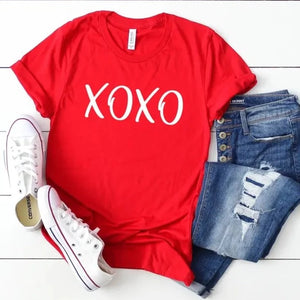 What a fun way to bring in Valentine's Day! Our hugs & kisses tee is in a beautiful red color with "XOXO" lettering in white. These are so soft & comfy that you will love wearing them to get-togethers, shopping, or running errands. The styling possibilities are endless. Roll up the sleeves, tie a side knot, front tuck, or wear it while lounging around the house. We guarantee that you will love this shirt's fit and softness.