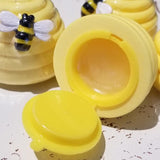 This honey-vanilla-scented lip gloss shaped like a yellow beehive may be the cutest thing you can buy today! There is a bee along the side as decoration. The lipgloss opens at the bottom.