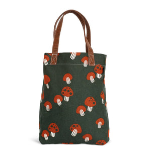 The cutest mushrooms adorn our fanny pack! The burnt-orange and cream mushrooms are scattered on top of a pine-colored background. All of our bags are printed on recycled canvas with eco-friendly pigment inks. Our canvas totes are soft yet durable and an easy carry-all. Not just for the market. This streamlined tote features an interior strap and hooks to attach our pouches. Printed on recycled canvas with eco-friendly pigment inks.   Dimensions: 12" x 16" x 4"     Strap Drop: 6.25". Made in India