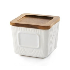 You will love using our new loose-leaf, stackable tea canister.  The stoneware canister is white with a textured woodgrain finish. It has a space on the front so you can write what tea is in your canister with a dry erase marker. It has an Acacia wood lid with a silicone airtight seal which makes it perfect for storing teas.  The canister is dishwasher safe. Hand wash the lid if possible.  BPA Free 10oz/296mls  3.5" w x 3.5" w x 3"h