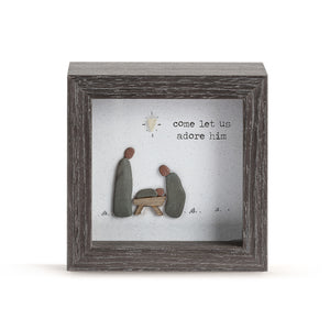 We love this new shadow box by Sharon Nowlan. It has a sweet scene of the Holy Family inside made of sea-washed pebbles and on the glass, it says "come let us adore him"  and is a gorgeous way to decorate any home.  4"w x 2"d x 4"h