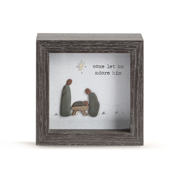 We love this new shadow box by Sharon Nowlan. It has a sweet scene of the Holy Family inside made of sea-washed pebbles and on the glass, it says 