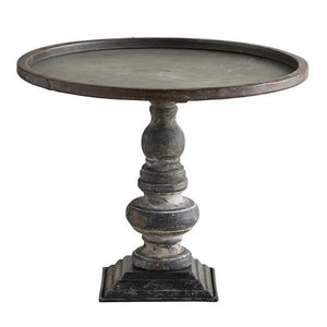 This stand will be so fun to decorate with!  The distressed black metal base holds a round galvanized tray with an accent brown distressed metal rim around the outer edge.   Metal  11.25" Round top  Base: 4.5"  Total height: 9″