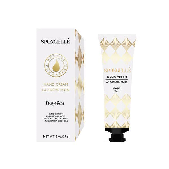 A spongelle white box and next to it is the Spongelle hand cream that comes in the box.  THis hand cream is Fresia Pear and is a 2oz bottle