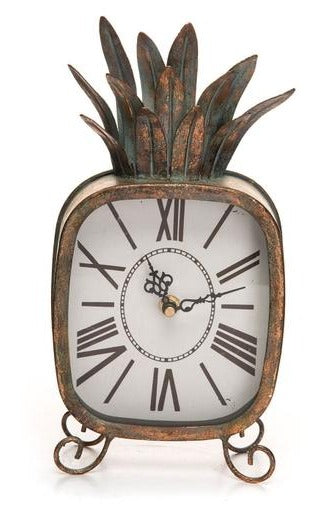 Our Pineapple Clock is a fun accent piece to add to any space. This metal clock features a distressed copper patina finish in the shape of a pineapple. Large Roman numerals and an analog display make telling the time easy.  Battery Operated: Requires 1 AA battery, not included.  Size:  6