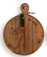 Set the table in style with this mini wood serving board that says "eat well" at the top. Included is a wooden spreader with a green handle. It is so fun to serve your favorite cheeses or munchies on, or as a fun gift idea for a new homeowner.  5"w x 6.5"h  Acacia wood, Handwash Only, Food Safe